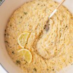 Lemon parmesan orzo in a white pot.